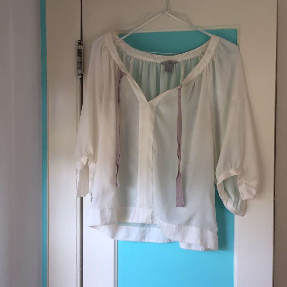 Loose and sheer cream blouse with beige ribbons